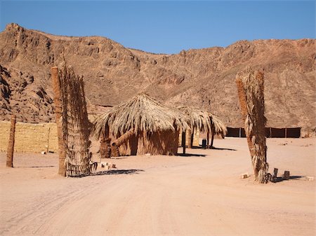 straw huts - Bedouin village in Sahara desert on mountain landscape Stock Photo - Budget Royalty-Free & Subscription, Code: 400-05704304