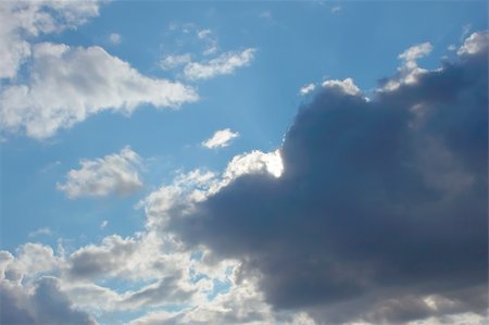 simsearch:400-05880107,k - Beautiful autumn cloudscape, dark grey and white clouds on the blue sky Photographie de stock - Aubaine LD & Abonnement, Code: 400-05704467