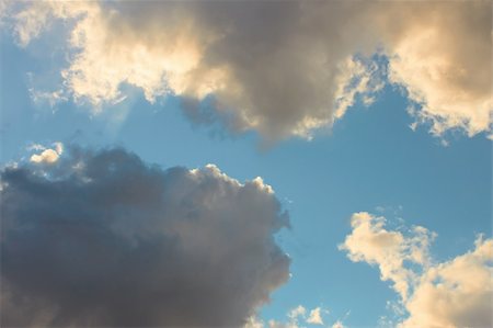 simsearch:400-05880107,k - Cloudscape, dark gray and light yellowish clouds on the blue sky Photographie de stock - Aubaine LD & Abonnement, Code: 400-05704468