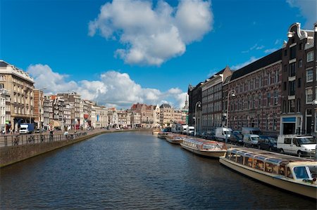 sightseeing boats in typical amsterdam canal Stock Photo - Budget Royalty-Free & Subscription, Code: 400-05704481