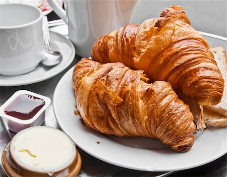 eating bread and butter - Breakfast with coffee and croissants in a basket on table Stock Photo - Budget Royalty-Free & Subscription, Code: 400-05704519