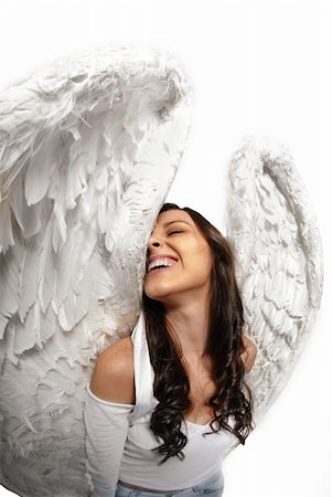 simsearch:400-05881632,k - Young woman standing with angel wings isolated on white taken with wide angle lens Stock Photo - Budget Royalty-Free & Subscription, Code: 400-05704641