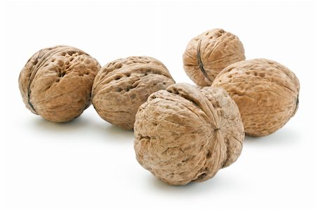 simsearch:400-04415203,k - Arrangement of five whole walnuts close-up isolated on white background. Fotografie stock - Microstock e Abbonamento, Codice: 400-05704781