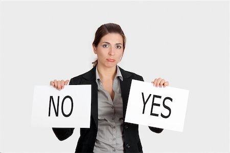 Business young woman trying to make a decision between Yes or No choice Stock Photo - Budget Royalty-Free & Subscription, Code: 400-05705059