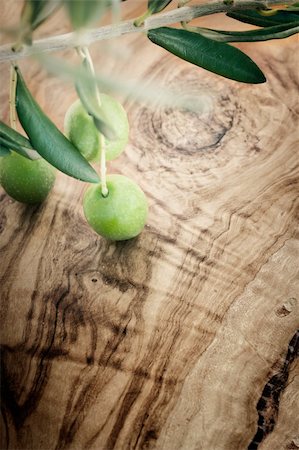 Summer olives nature background with fresh olive branch and olive wood Stock Photo - Budget Royalty-Free & Subscription, Code: 400-05705098