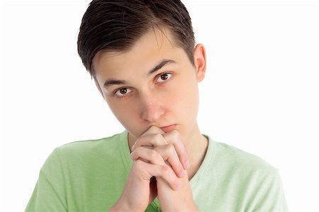 simsearch:400-04178541,k - A boy with hands clenched in prayer.  White background. Photographie de stock - Aubaine LD & Abonnement, Code: 400-05705120