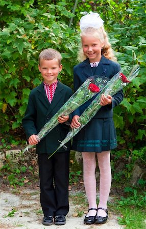 Outdoor portrait of nice little girl and boy before they first visit to the school Stock Photo - Budget Royalty-Free & Subscription, Code: 400-05705549