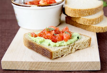 sandwich with avocado - sandwich with avocado and tomato on a wooden board Stock Photo - Budget Royalty-Free & Subscription, Code: 400-05705805