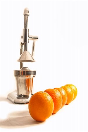 saftpresse - oranges with juicer on white background Stockbilder - Microstock & Abonnement, Bildnummer: 400-05706124