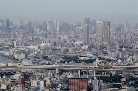 Skyline of Osaka City in Japan with lots of skyscrapers and streets Stock Photo - Budget Royalty-Free & Subscription, Code: 400-05706129