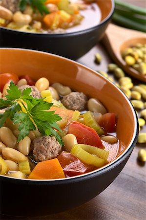 simsearch:400-04855321,k - Canary bean soup with meatballs and other vegetables garnished with a parsley leaf (Selective Focus, Focus on the meatball in the front and the front of the parsley) Stock Photo - Budget Royalty-Free & Subscription, Code: 400-05706804