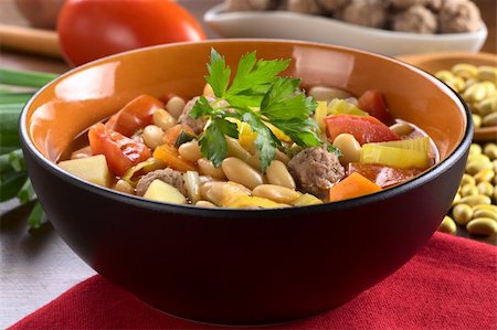 simsearch:400-04855321,k - Canary bean soup with meatballs and other vegetables garnished with a parsley leaf (Selective Focus, Focus on the meatball in the front) Stock Photo - Budget Royalty-Free & Subscription, Code: 400-05706802