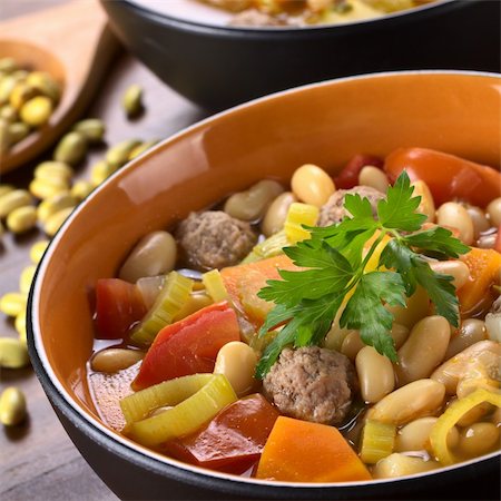 simsearch:400-04855321,k - Canary bean soup with meatballs and other vegetables garnished with a parsley leaf (Selective Focus, Focus on the meatball in the front and the front of the parsley) Stock Photo - Budget Royalty-Free & Subscription, Code: 400-05706803