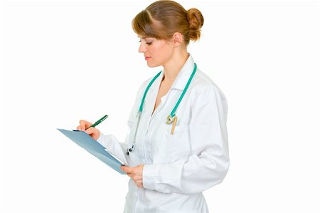 simsearch:400-07099882,k - Medical female doctor writing in medical chart isolated on white Photographie de stock - Aubaine LD & Abonnement, Code: 400-05706947