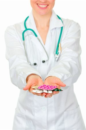 simsearch:400-07099832,k - Closeup on pills on medical doctor woman hands isolated on white Stock Photo - Budget Royalty-Free & Subscription, Code: 400-05706948