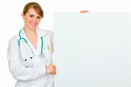 simsearch:400-07099823,k - Smiling medical female doctor holding blank billboard isolated on white Stock Photo - Budget Royalty-Free & Subscription, Code: 400-05706952
