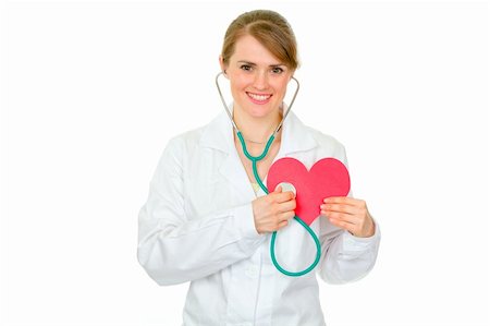 simsearch:400-04351236,k - Happy medical female doctor holding stethoscope on paper heart isolated on white Photographie de stock - Aubaine LD & Abonnement, Code: 400-05706966