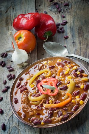 Chili con carne plate. Mexican traditional dish in rustic setting Stock Photo - Budget Royalty-Free & Subscription, Code: 400-05707056