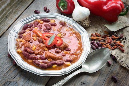 Chili con carne plate. Mexican traditional dish in rustic setting Stock Photo - Budget Royalty-Free & Subscription, Code: 400-05707057