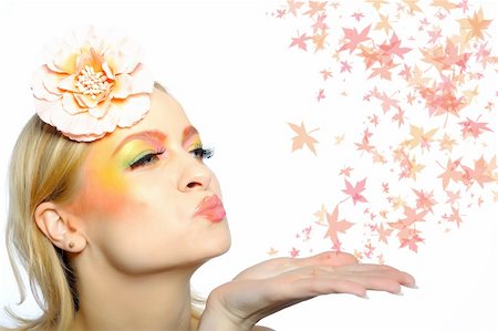 simsearch:400-04590632,k - Concept of autumn fashion woman with creative eye make-up blowing autumn leafs from her hand Stock Photo - Budget Royalty-Free & Subscription, Code: 400-05707174