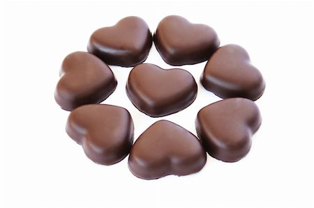 simsearch:400-05216743,k - Heart shape chocolates isolated on white background. Foto de stock - Super Valor sin royalties y Suscripción, Código: 400-05709347