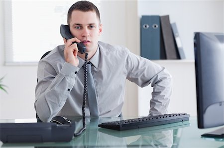 simsearch:400-05709706,k - Young businessman on the telephone Stock Photo - Budget Royalty-Free & Subscription, Code: 400-05709692