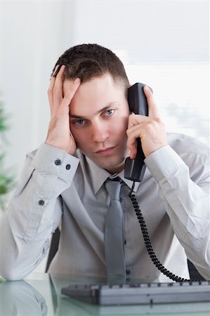 simsearch:400-05709706,k - Sad and depressed businessman on the phone Stock Photo - Budget Royalty-Free & Subscription, Code: 400-05709717