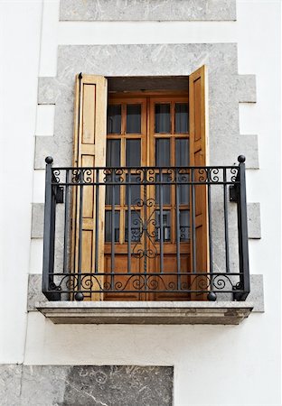 The Renovated Facade of the Old Spanish House with Balcony Stock Photo - Budget Royalty-Free & Subscription, Code: 400-05709721