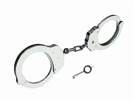 metal handcuffs with key isolated on white background Stock Photo - Budget Royalty-Free & Subscription, Code: 400-05709731