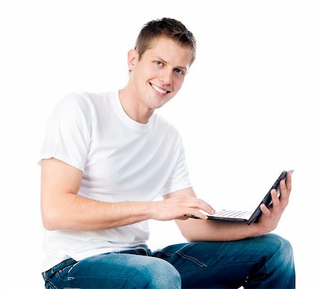 smart guy with a laptop isolated on white Foto de stock - Super Valor sin royalties y Suscripción, Código: 400-05701142