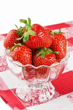 Ripe fresh strawberry in glass bowl on desert Fotografie stock - Microstock e Abbonamento, Codice: 400-05701378