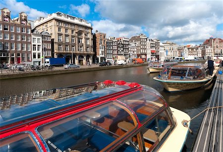 sightseeing boats in typical amsterdam canal Stock Photo - Budget Royalty-Free & Subscription, Code: 400-05701604