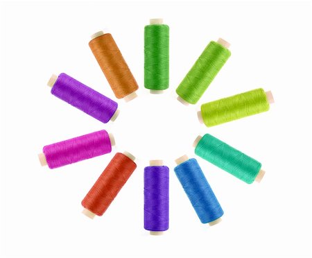 sewing factory - Multicolor sewing threads on white background Photographie de stock - Aubaine LD & Abonnement, Code: 400-05701635