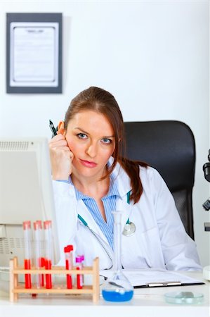 simsearch:400-04925813,k - Medical doctor woman tired of her work at office Stock Photo - Budget Royalty-Free & Subscription, Code: 400-05701703