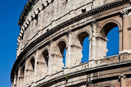 round amphitheatre - Colosseum in Rome with blue sky, landmark of the city Stock Photo - Budget Royalty-Free & Subscription, Code: 400-05701890