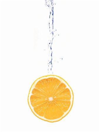 Citrus fruit and flowing water isolated against a white background Stock Photo - Budget Royalty-Free & Subscription, Code: 400-05703179