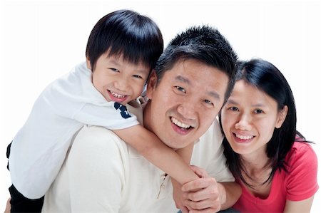 Happy Asian family on white background Stock Photo - Budget Royalty-Free & Subscription, Code: 400-05703194