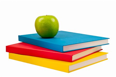 Three books with a green apple on top.This has a clipping path. Stock Photo - Budget Royalty-Free & Subscription, Code: 400-05714638