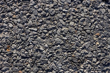 Fragment of the road surface with small stones and bitumen. Close-up Foto de stock - Super Valor sin royalties y Suscripción, Código: 400-05714729