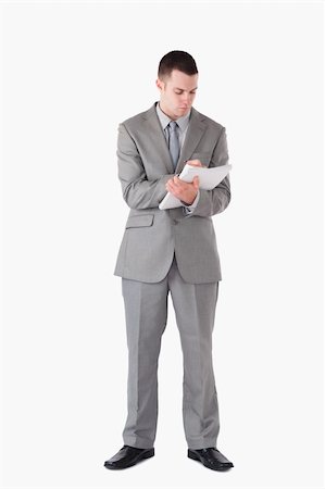 simsearch:400-04184820,k - Portrait of a businessman taking notes against a white background Foto de stock - Super Valor sin royalties y Suscripción, Código: 400-05714868