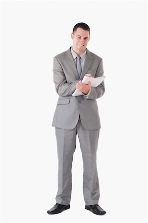 simsearch:400-04782141,k - Portrait of a smiling businessman taking notes against a white background Stock Photo - Budget Royalty-Free & Subscription, Code: 400-05714869