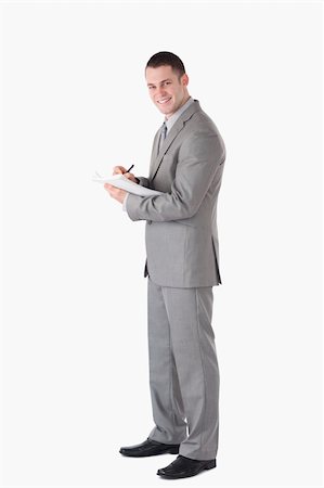 simsearch:400-04184820,k - Portrait of a young businessman taking notes against a white background Foto de stock - Super Valor sin royalties y Suscripción, Código: 400-05714871