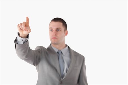 Businessman touching something against a white background Stock Photo - Budget Royalty-Free & Subscription, Code: 400-05714872