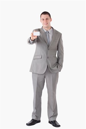 simsearch:400-05718318,k - Portrait of a businessman showing a business card against a white background Foto de stock - Super Valor sin royalties y Suscripción, Código: 400-05714886