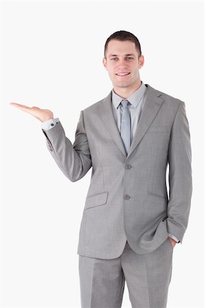 simsearch:400-05714996,k - Portrait of a young businessman holding something on his palm Foto de stock - Super Valor sin royalties y Suscripción, Código: 400-05714902