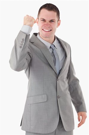 simsearch:400-05714996,k - Portrait of a businessman with his fist up against a white background Foto de stock - Super Valor sin royalties y Suscripción, Código: 400-05714996