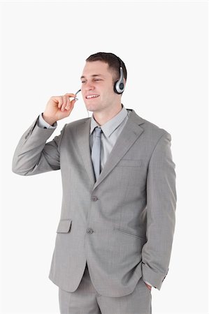 simsearch:400-05710310,k - Portrait of an operator with a headset against a white background Stock Photo - Budget Royalty-Free & Subscription, Code: 400-05715021