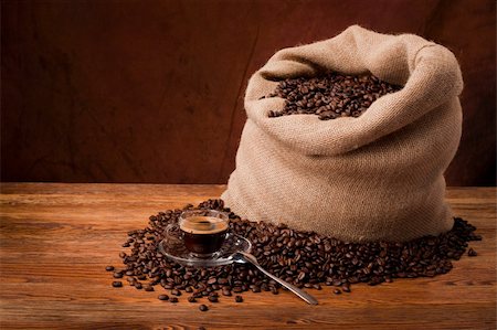 Studio photo of sack with scattered coffee grain, and cup of espresso Stock Photo - Budget Royalty-Free & Subscription, Code: 400-05715066