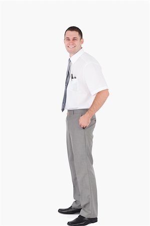 simsearch:400-07820348,k - Portrait of a young office worker with the hands on his pockets against a white background Photographie de stock - Aubaine LD & Abonnement, Code: 400-05715084