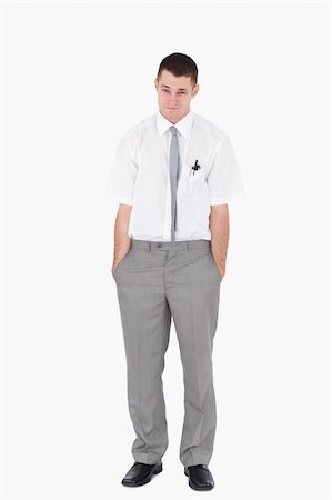 simsearch:400-05718341,k - Portrait of an office worker with the hands on his pockets against a white background Stock Photo - Budget Royalty-Free & Subscription, Code: 400-05715081
